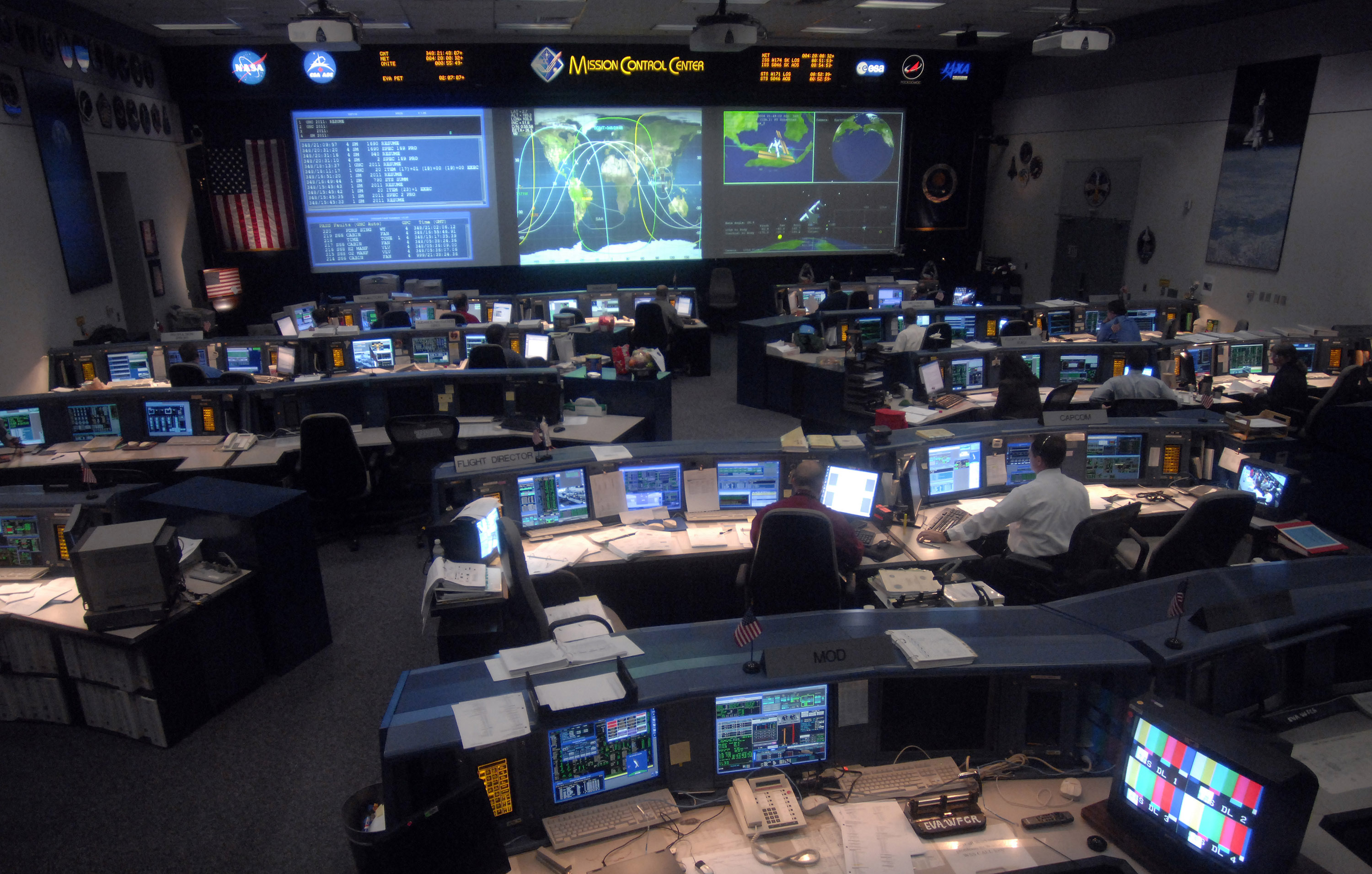 Astronauts work in the Mission Control Center during a space shuttle mission to the International Space Center Dec. 15 at the Johnson Space Center in Houston. (U.S. Air Force photo/Tech. Sgt. Larry Simmons); source: https://www.af.mil/News/Photos/igphoto/2000525294/